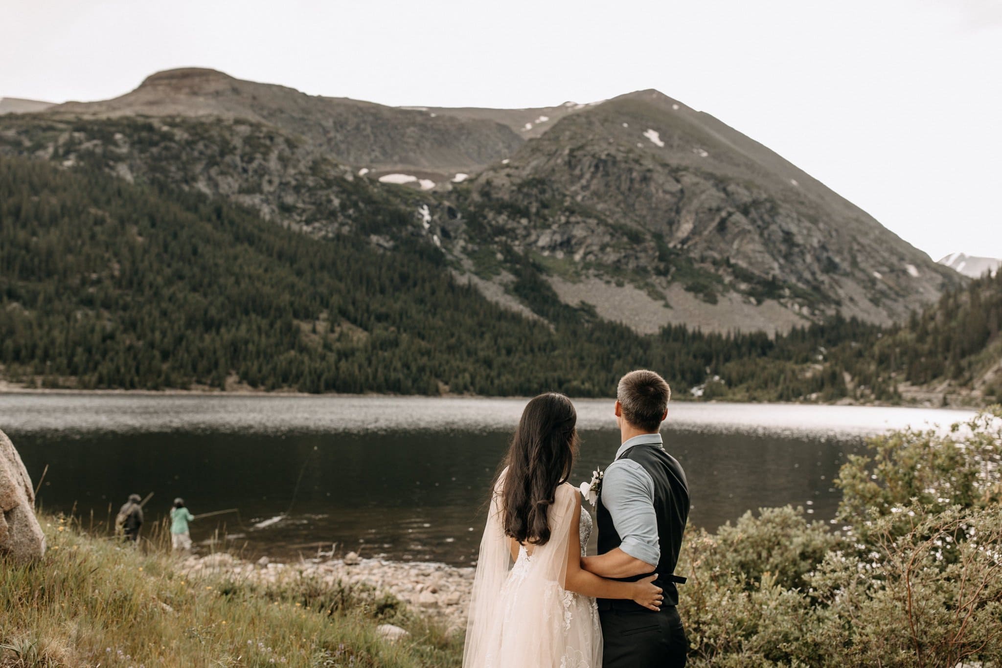 Wedding portraits by mountain lake in Breckenridge