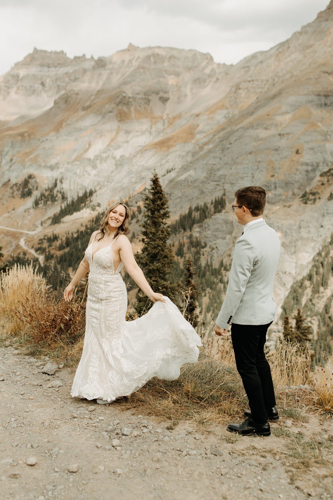 bride and groom first look on top of mountain in ouray