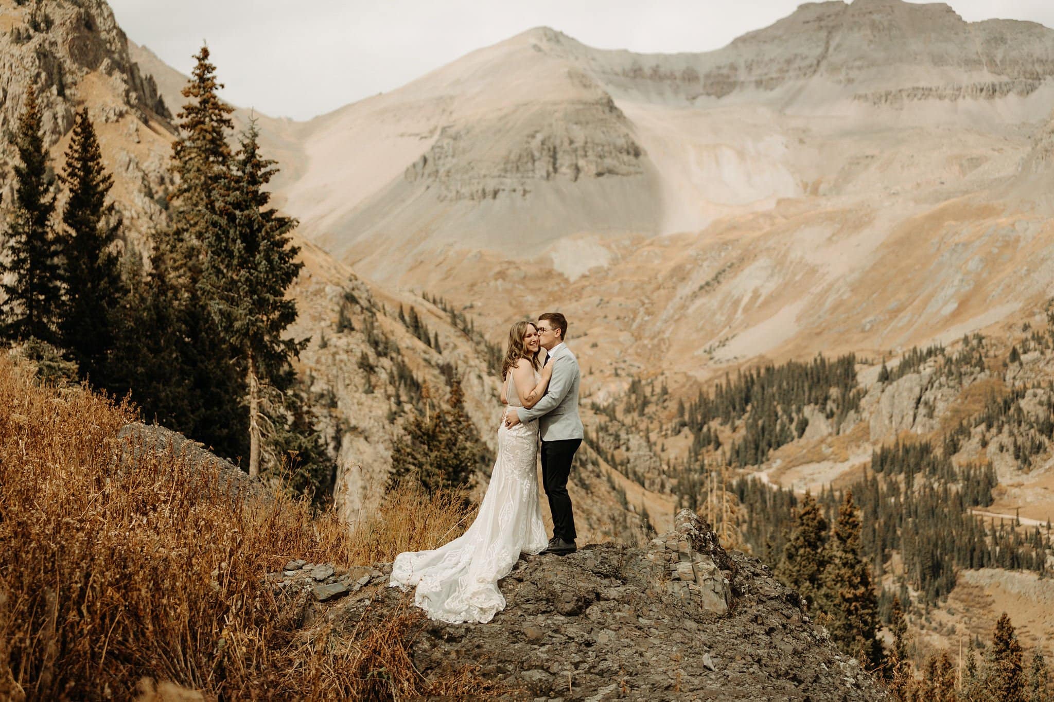 bride and groom first look on top of mountain in ouray
