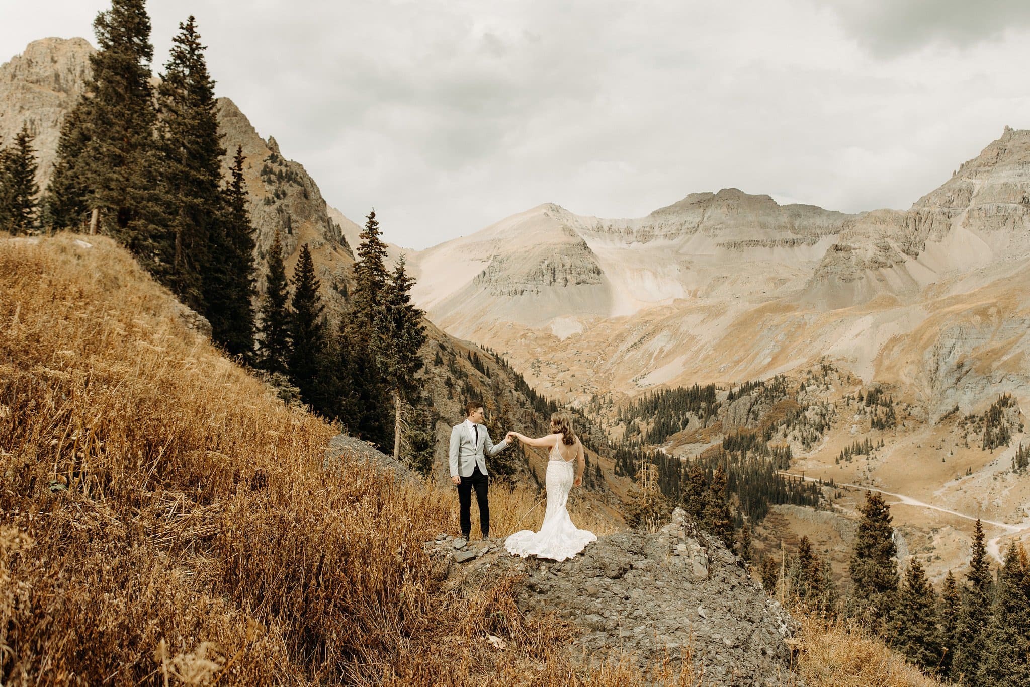 bride and groom first look on top of mountain in ouray