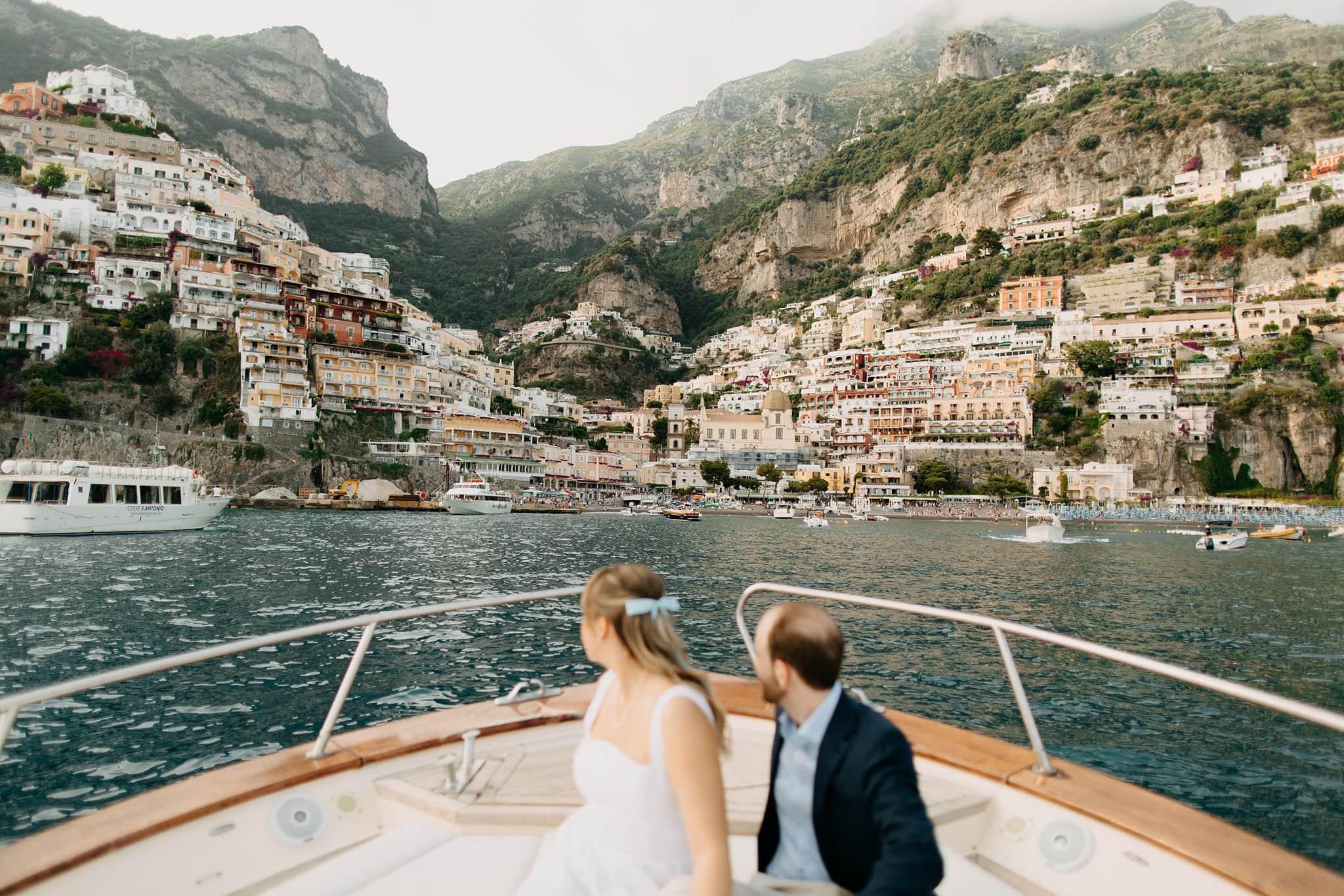 Engagement session boat cruise overlooking Positano at sunset