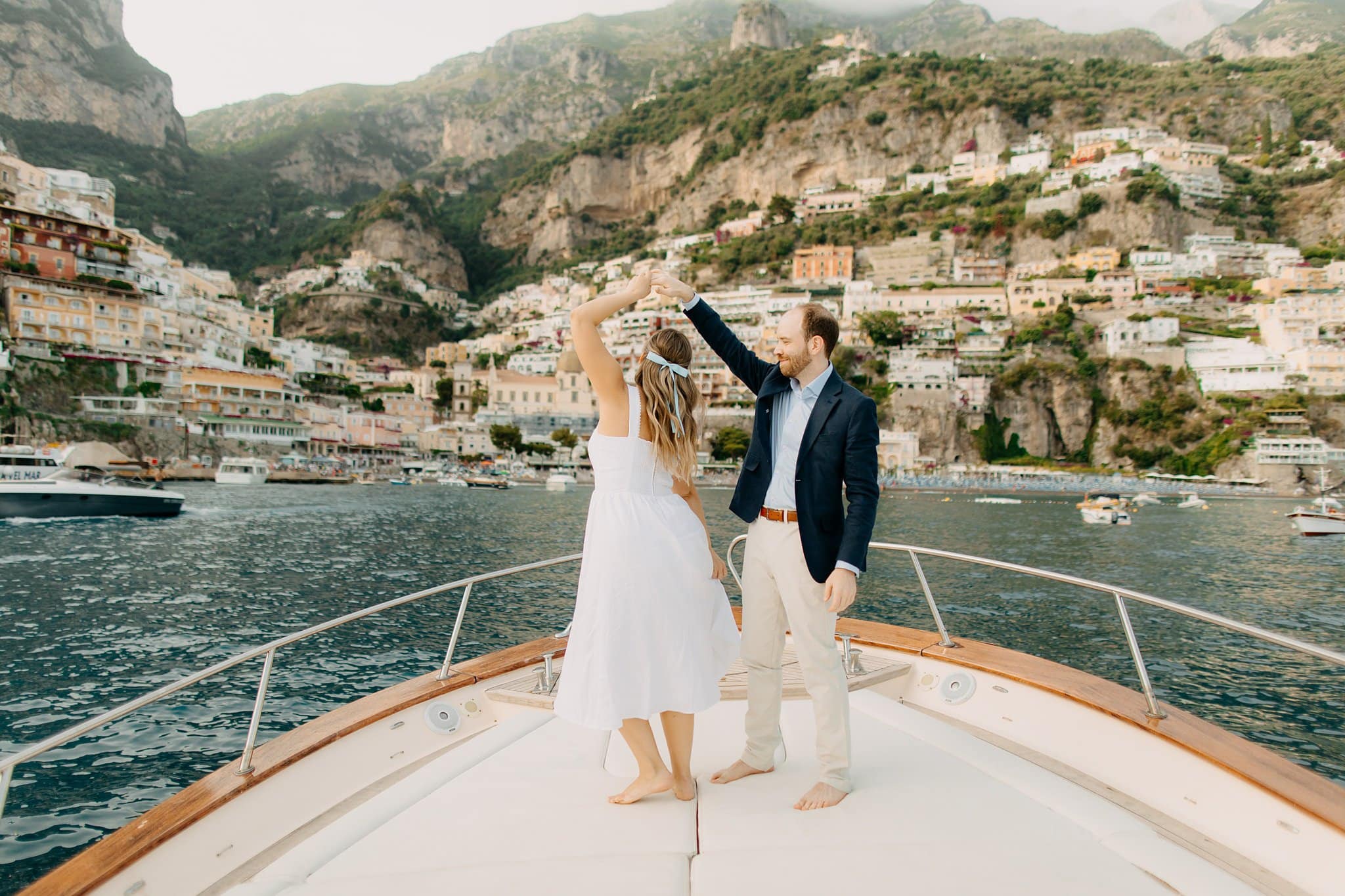 Engagement session boat cruise overlooking Positano at sunset
