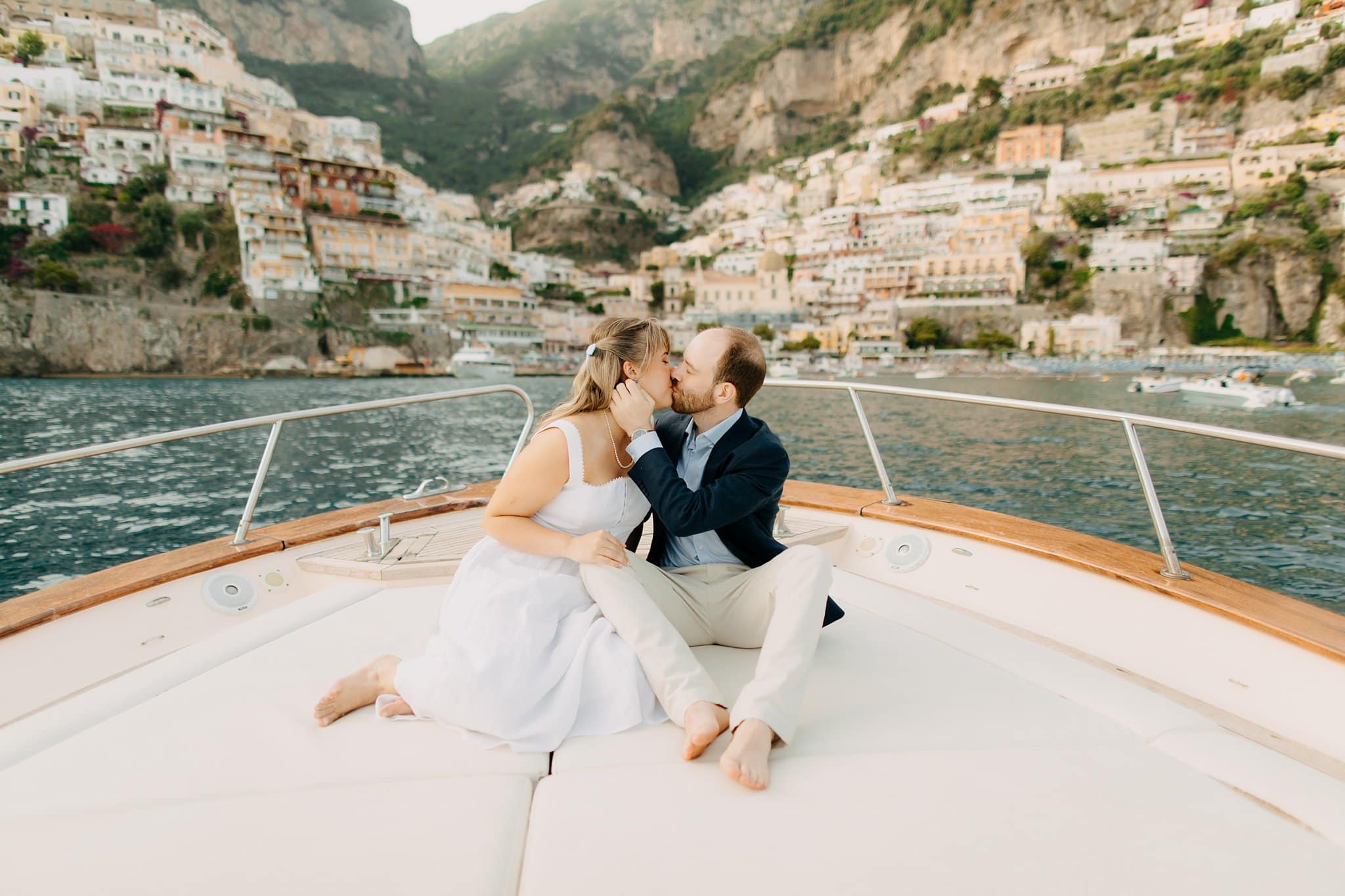 Engagement session boat cruise overlooking Positano at sunset