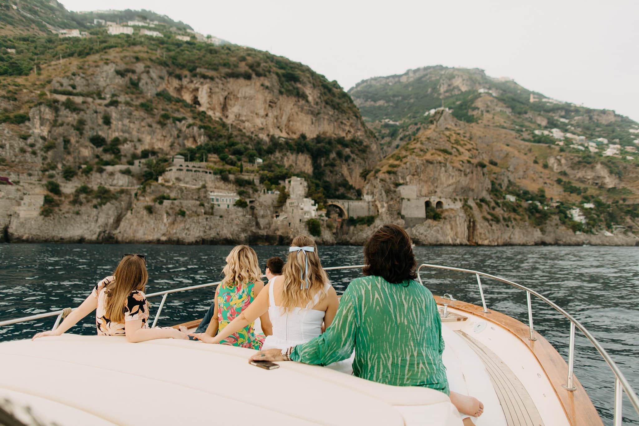 Engagement session boat cruise overlooking Positano at sunset