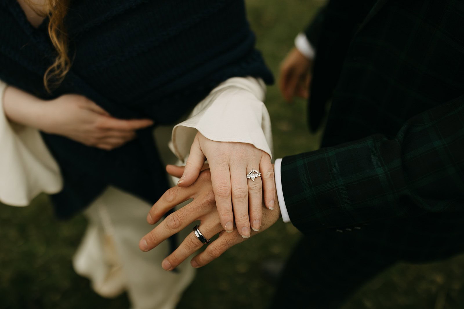 couple wearing wedding rings at the Quiraing, Isle of Skye elopement