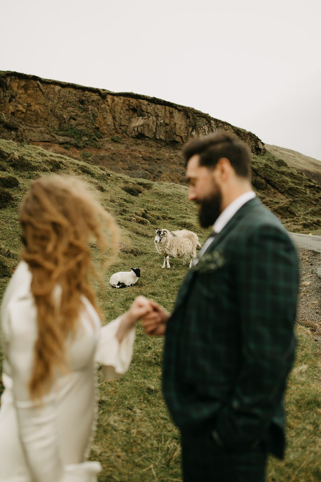 Couple eloping with sheep in the background at the Quiraing, Isle of Skye