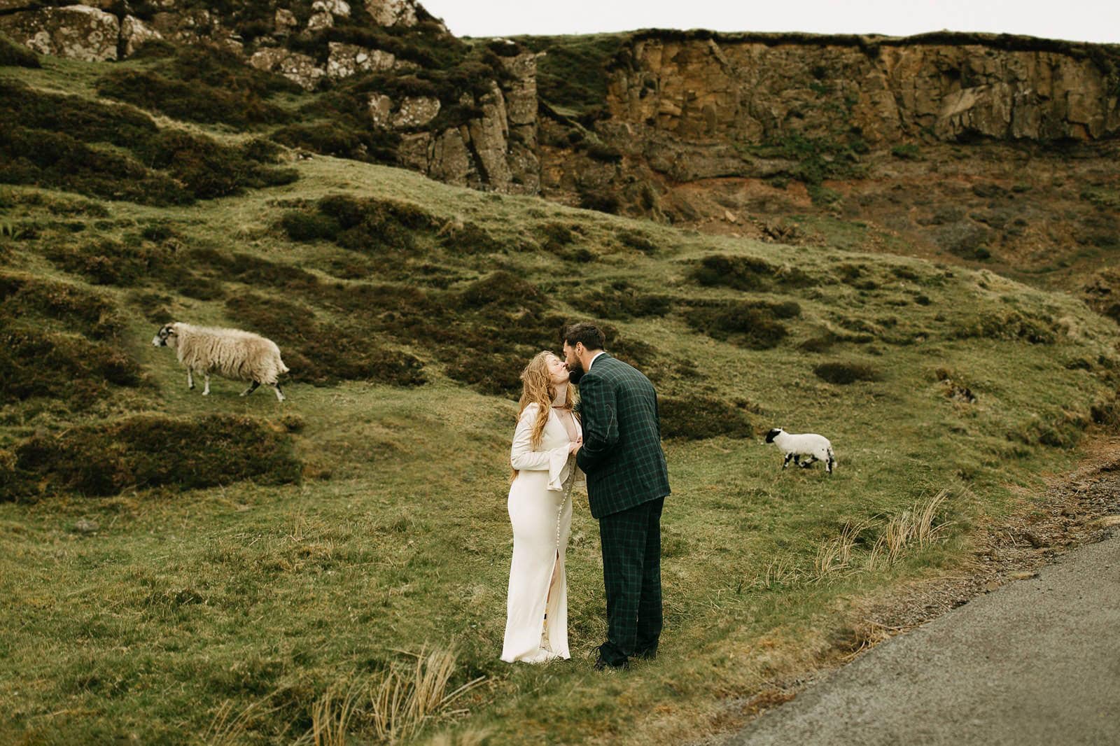 Couple eloping with sheep in the background at the Quiraing, Isle of Skye