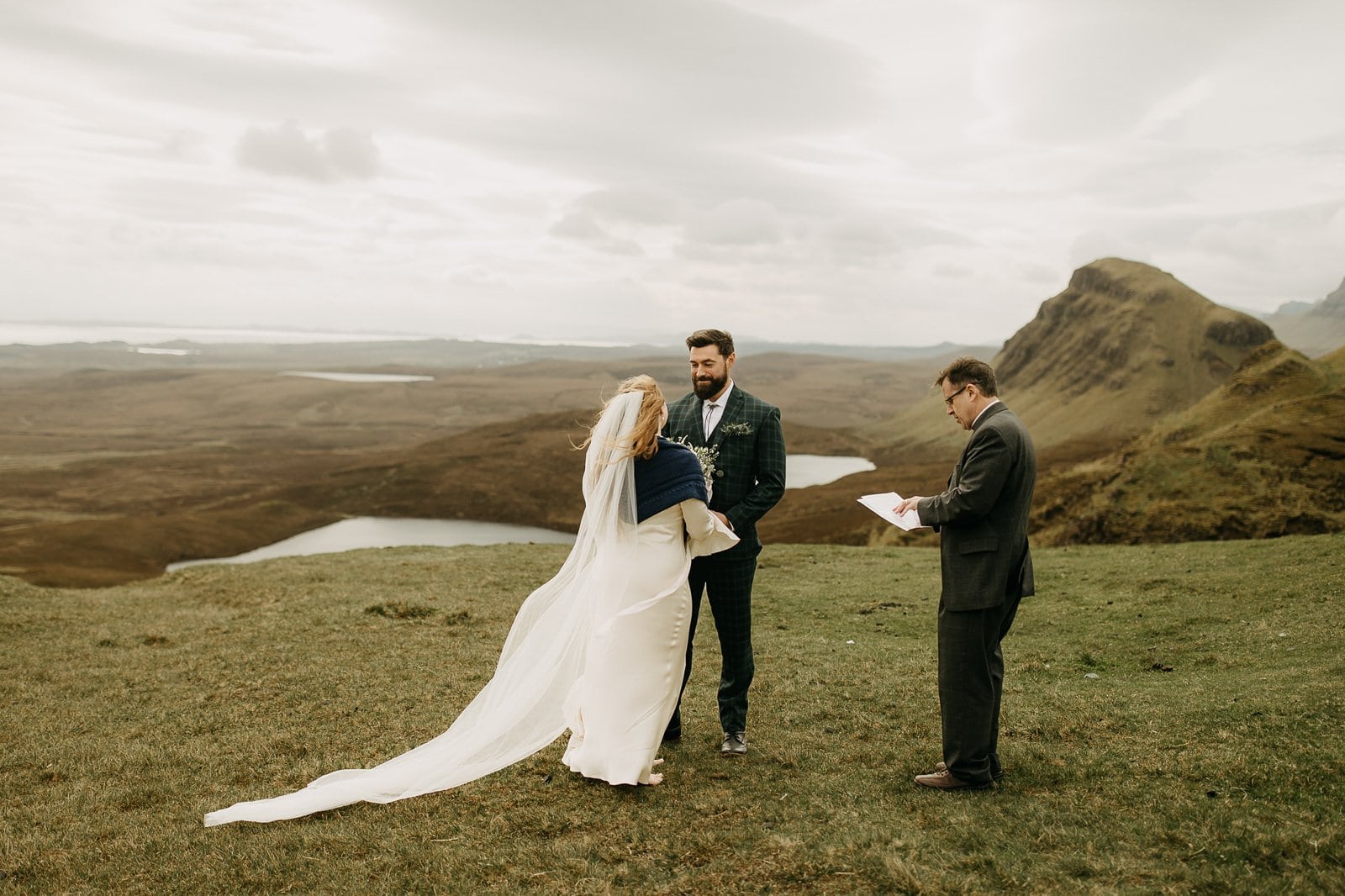 Couple exchanging vows at Quiraing, Isle of Skye elopement