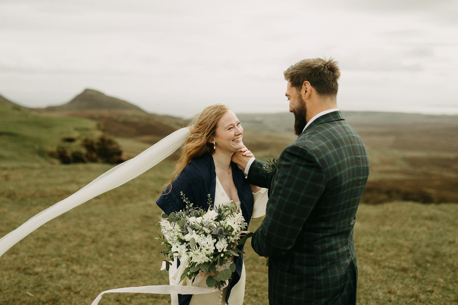 Couple exchanging vows at Quiraing, Isle of Skye elopement