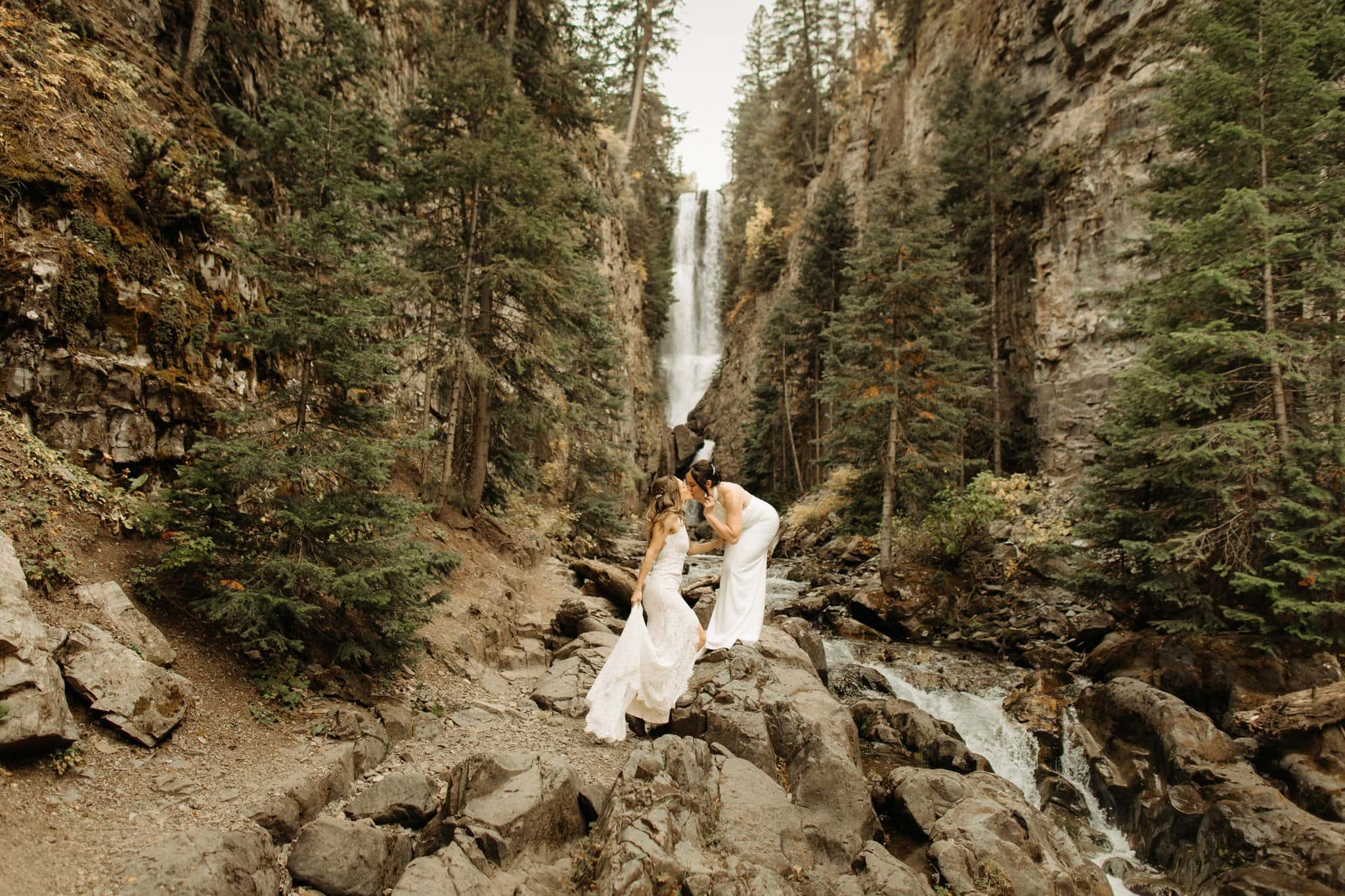 same sex hiking elopement to waterfall in telluride