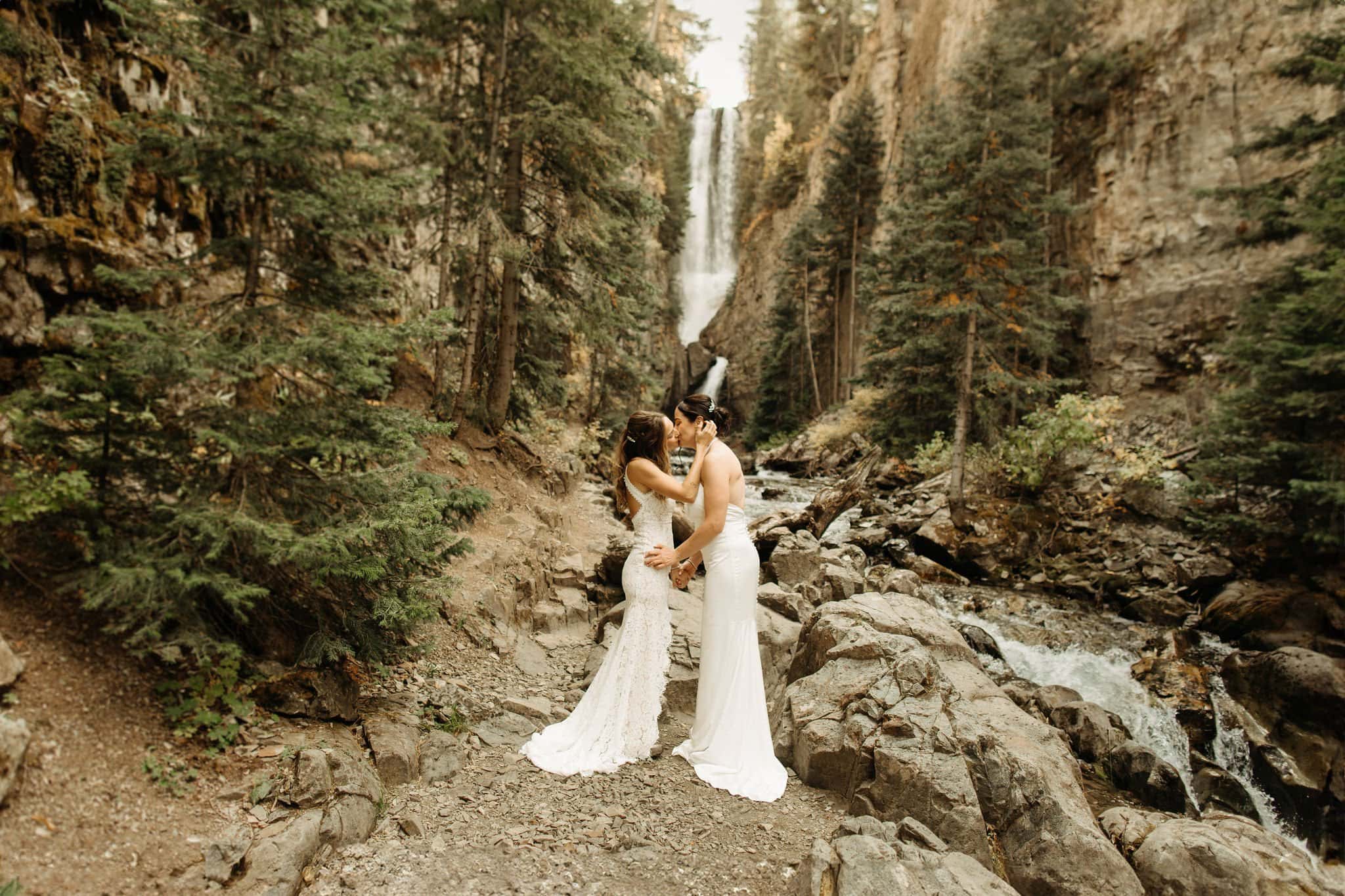 same sex hiking elopement to waterfall in telluride