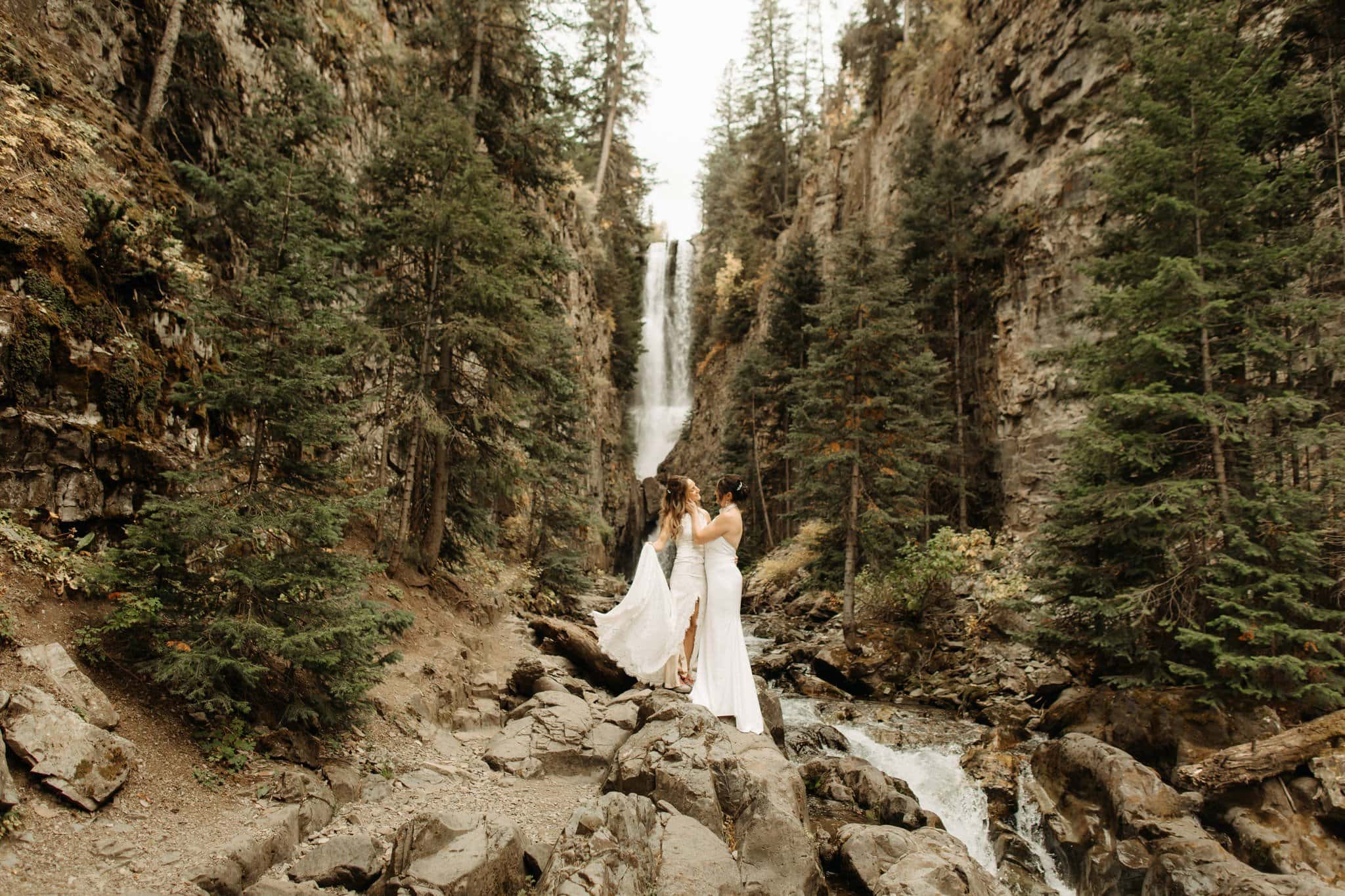 same sex hiking elopement to waterfall in telluride