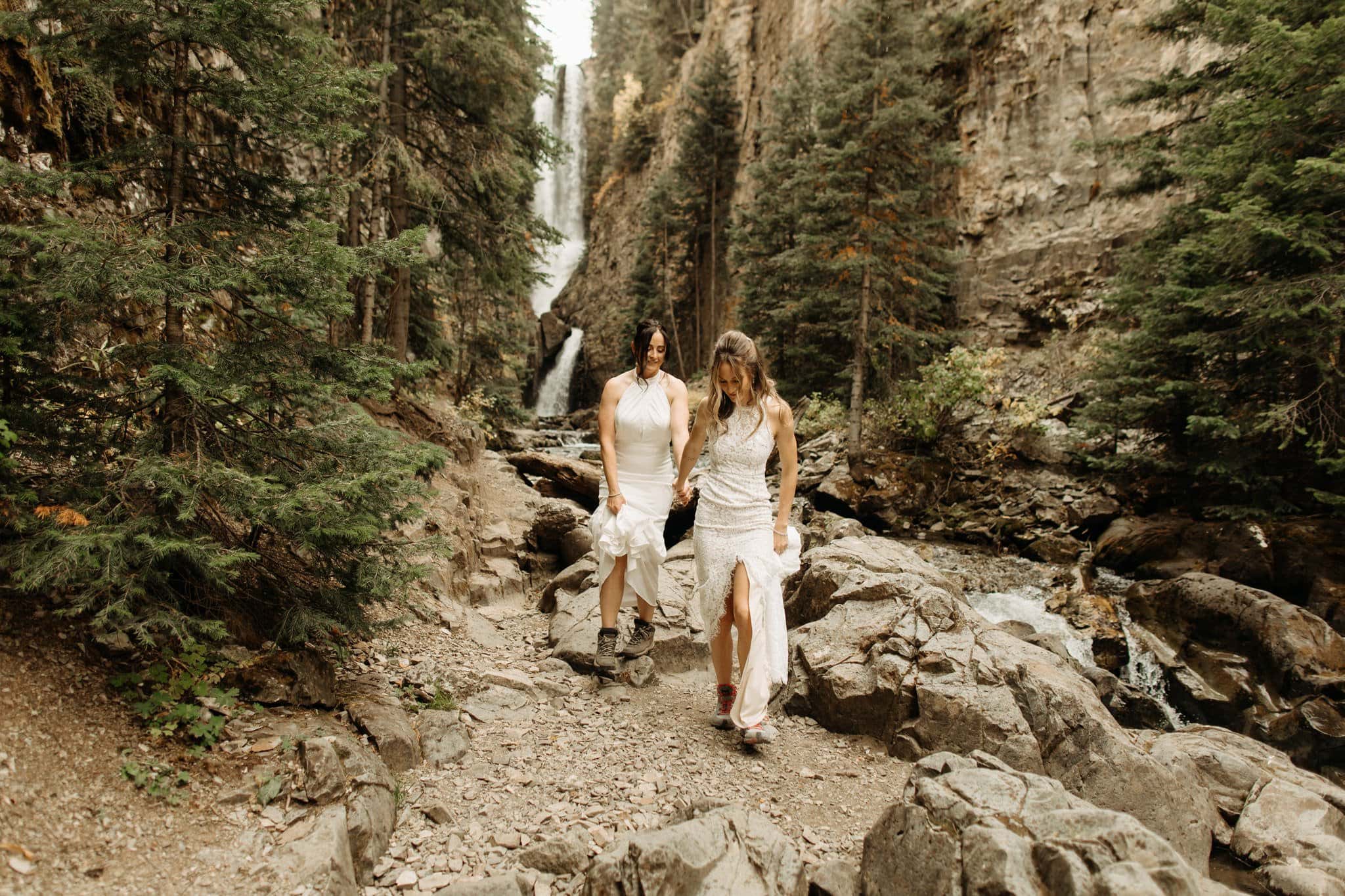 same sex hiking elopement to waterfall in telluride
