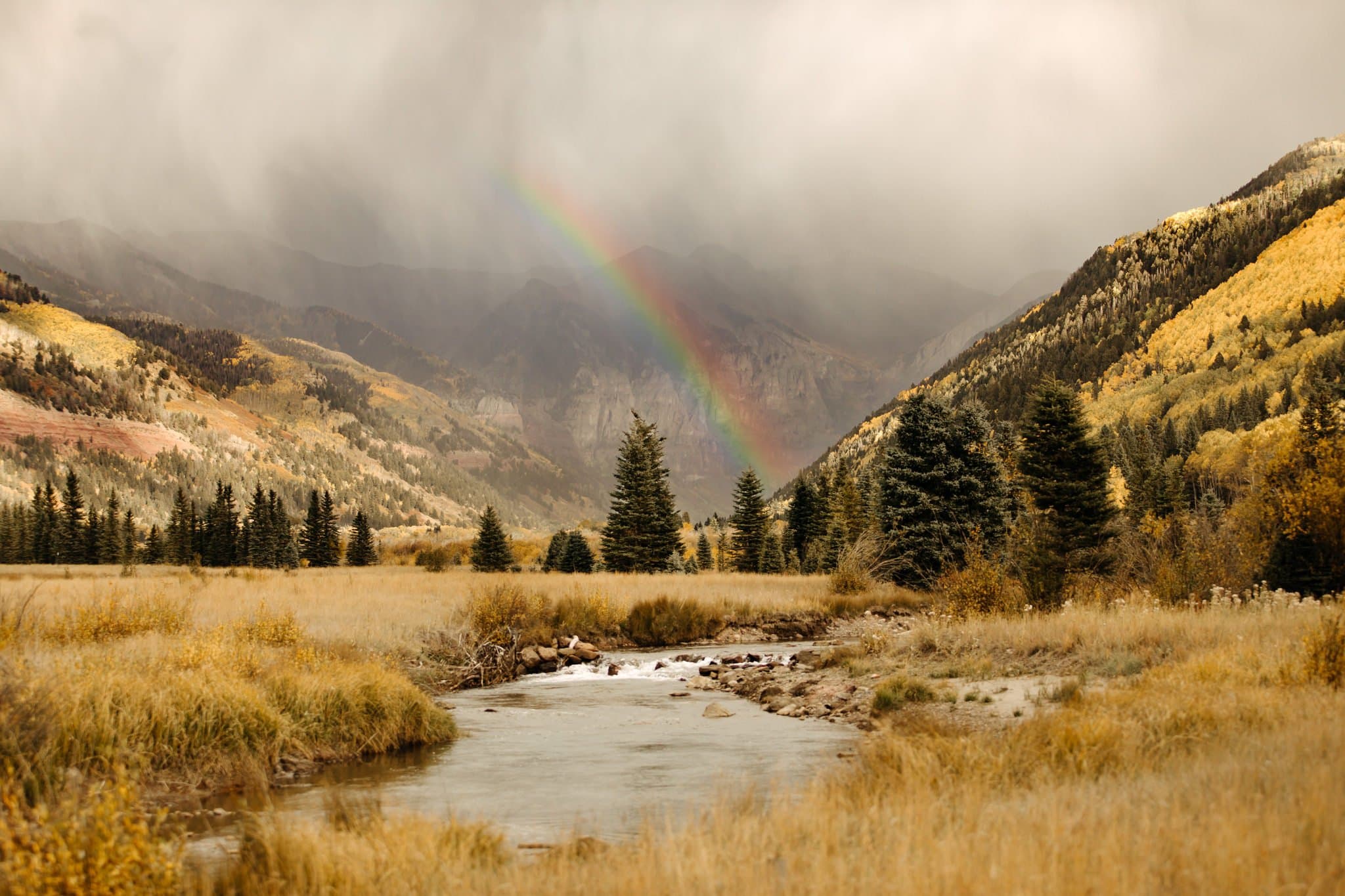 Romantic Same Sex Elopement under rainbow in Telluride