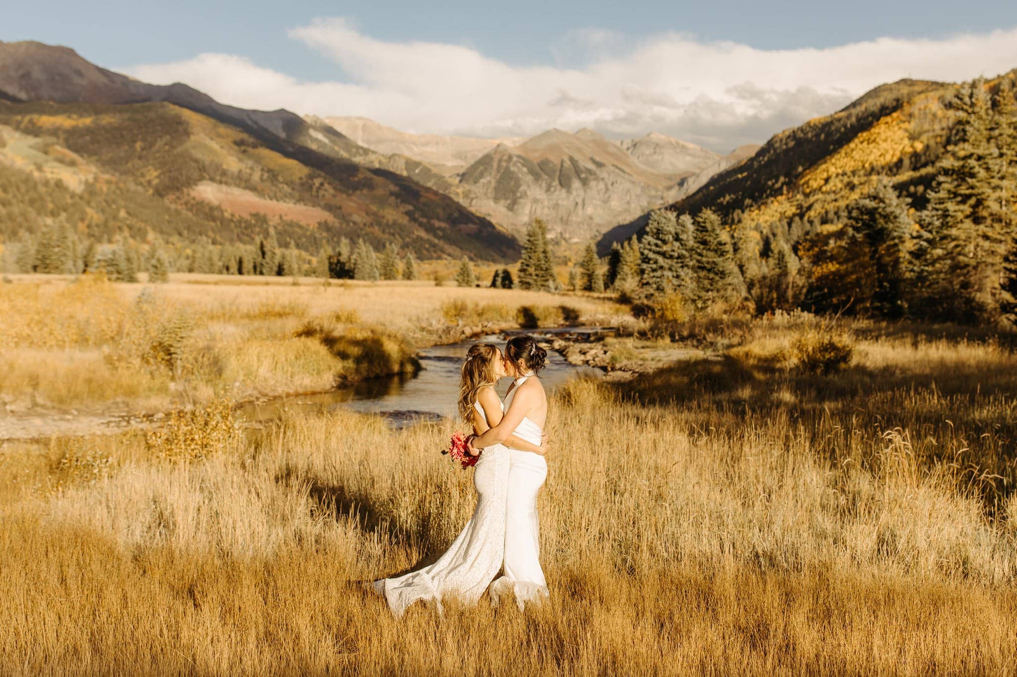 Romantic Same Sex Elopement under rainbow in Telluride