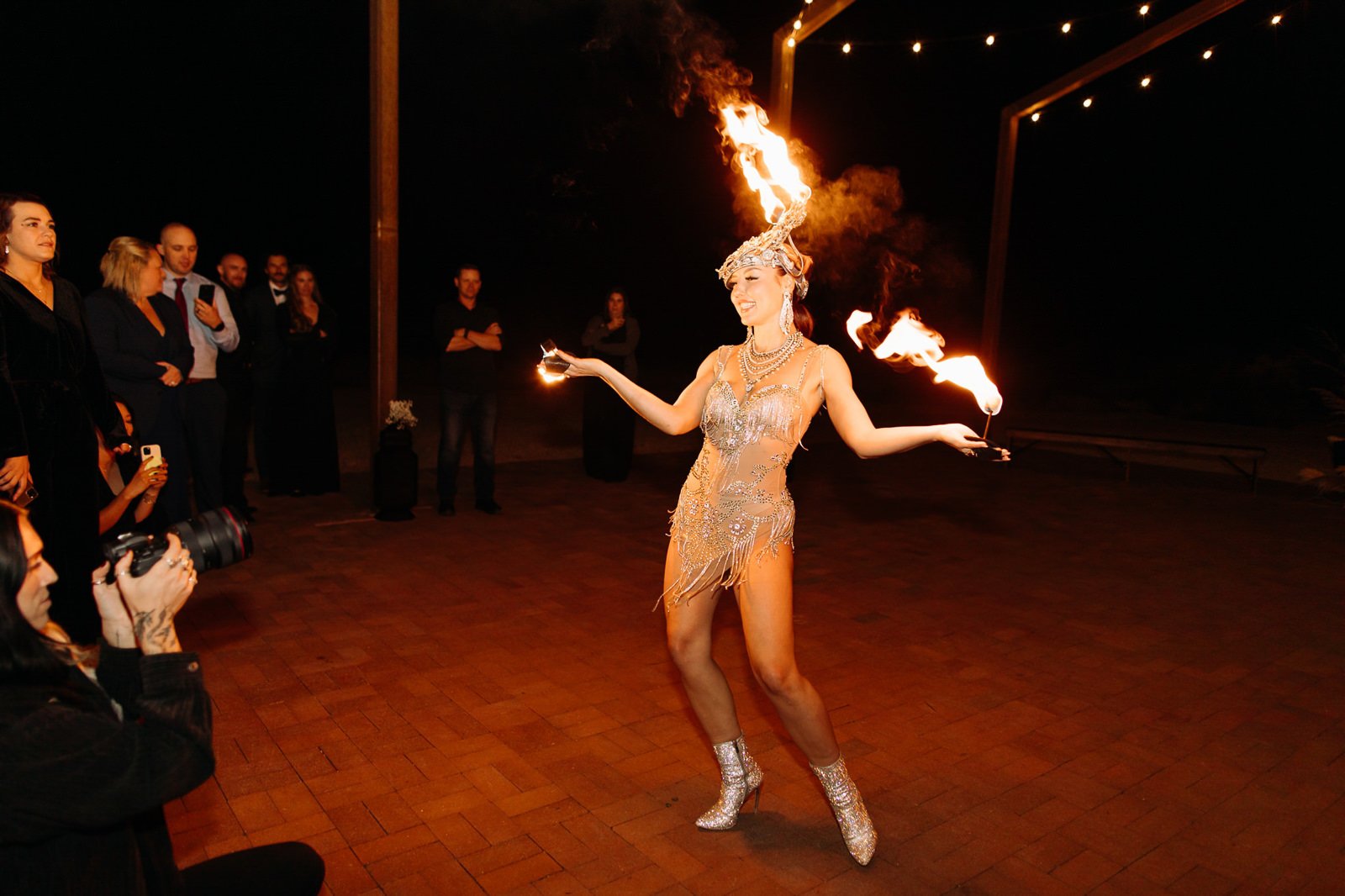 Fire dancers performing at a wedding at Red Earth Venue