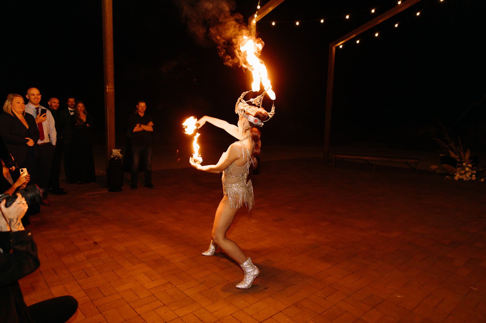 Fire dancers performing at a wedding at Red Earth Venue