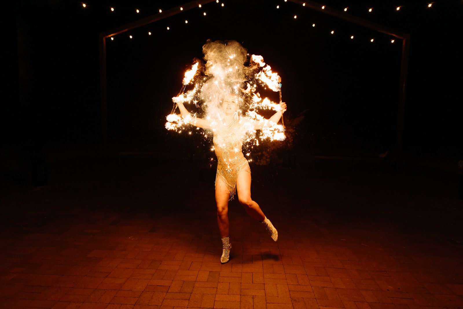Fire dancers performing at a wedding at Red Earth Venue